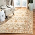 Handmade Ancestral Tree Ivory/ Green Wool Rug (9' x 12')