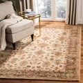 Handmade Heirloom Ivory/ Light Green Wool Rug (8' x 10')