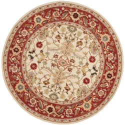 Hand-hooked Tabriz Ivory/ Red Wool Rug (5'6 Round)