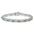 Malaika Sterling Silver Emerald and 1/10ct TDW Diamond Bracelet (I-J, I2-I3)