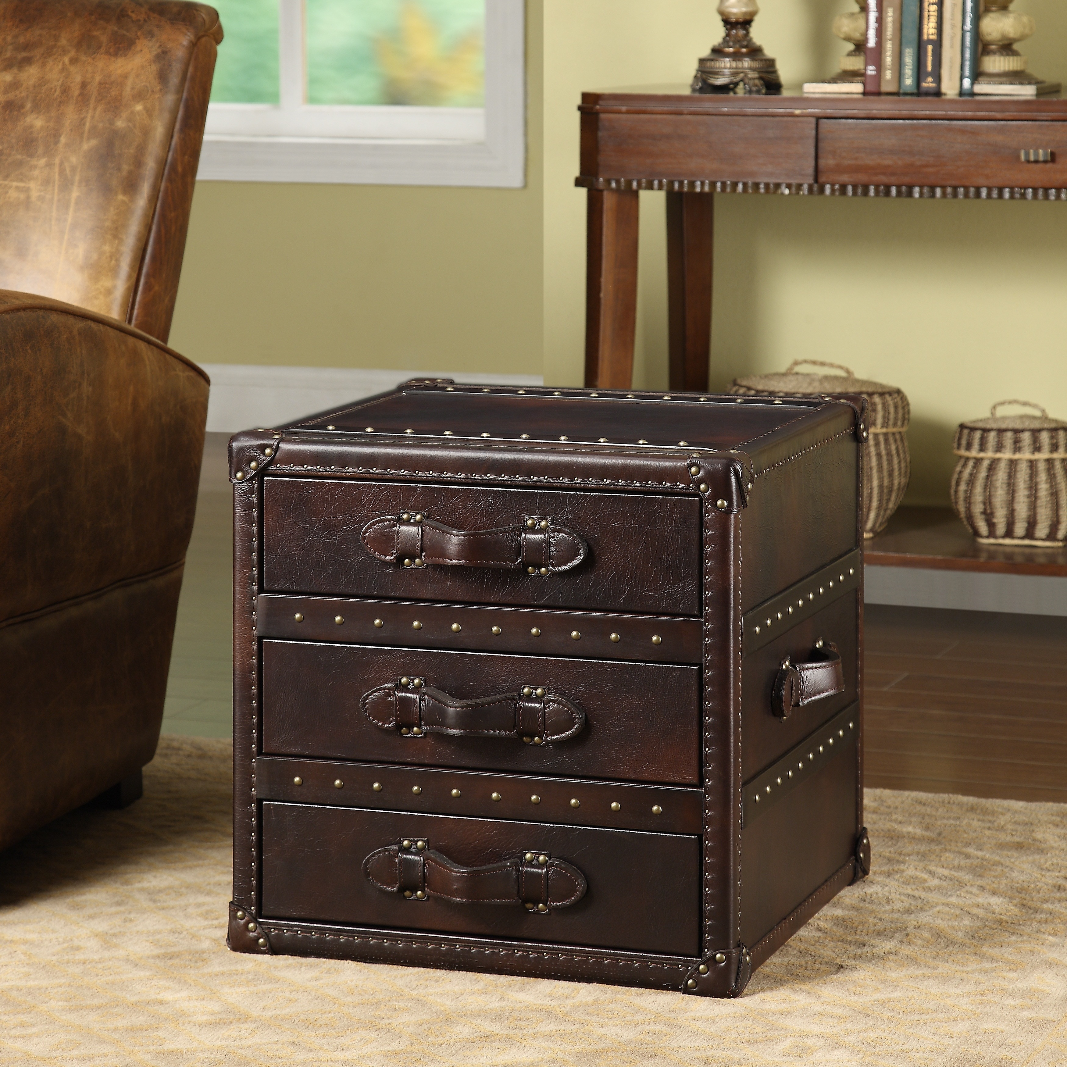 The General three drawer leather end table is handfinished, every nail