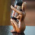 Handcrafted Suar Wood 'Warm Embrace' Wine Bottle Holder (Indonesia)