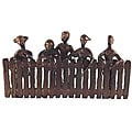 Handcrafted Children Peeking Over Fence Sculpture