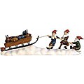 Santas Pulling Sled Statue