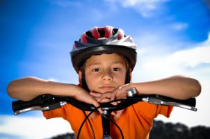 Boy wearing a bicycle helmet