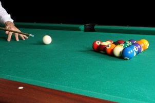 Man playing billiards