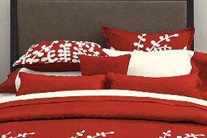 Red pillow cases on a bed