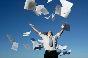 Businessman overwhelmed by paperwork