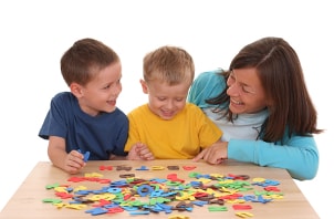 Kids and mom playing with a puzzle