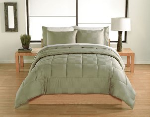 Bed with a designer comforter set and end tables