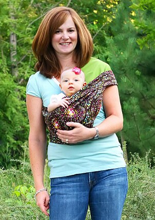 Mom carrying her baby in a baby sling
