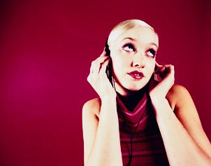 Music lover listening to her favorite song on an mp3 player