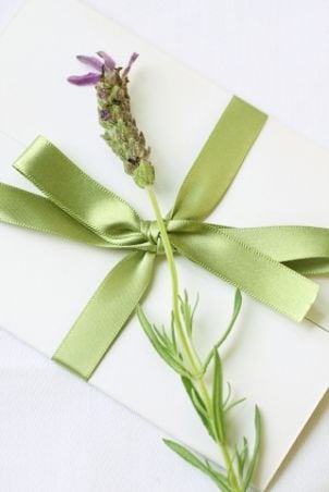 Handmade wedding invitation with fresh herbs
