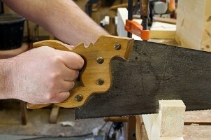 Man using a basic tool on a workbench