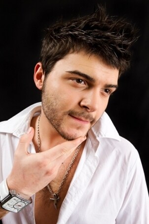 Handsome young man wearing white gold jewelry