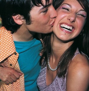 Cute young couple just got engaged with an engagement ring