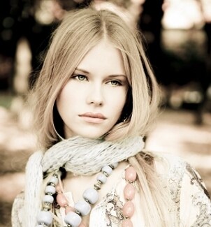 Beautiful woman wearing a scarf and gloves