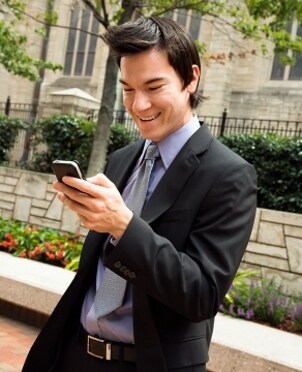 Young businessman enjoying his electronic gift