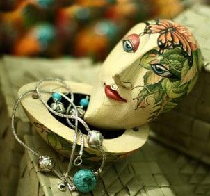 Beautiful wooden jewelry box with a face painted on top