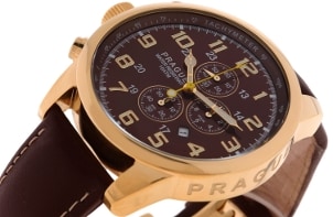A handsome men's watch with a brown dial, a gold case and brown leather watchbands