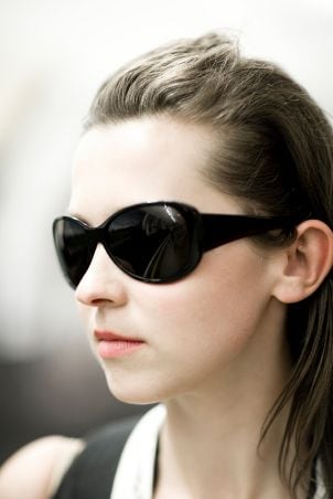 Young woman wearing dark sunglasses