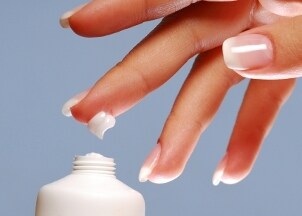 Women's hand with natural health and beauty lotion