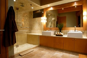 Large walk-in glass shower with honey tile