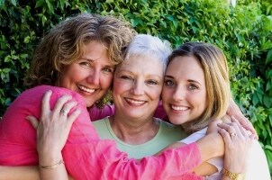 Three generations of women gather to exchange Mother's Day gifts