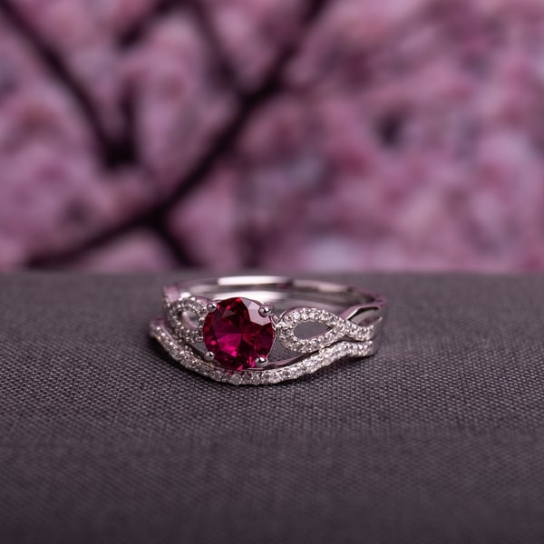 Miadora 10k White Gold Created Ruby and 1/6ct TDW Diamond Bridal Ring Set. Opens flyout.