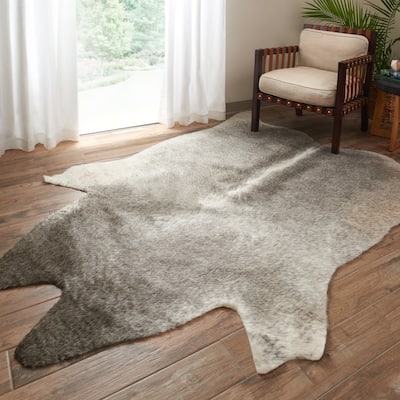 Alexander Home Faux Cowhide Area Rug