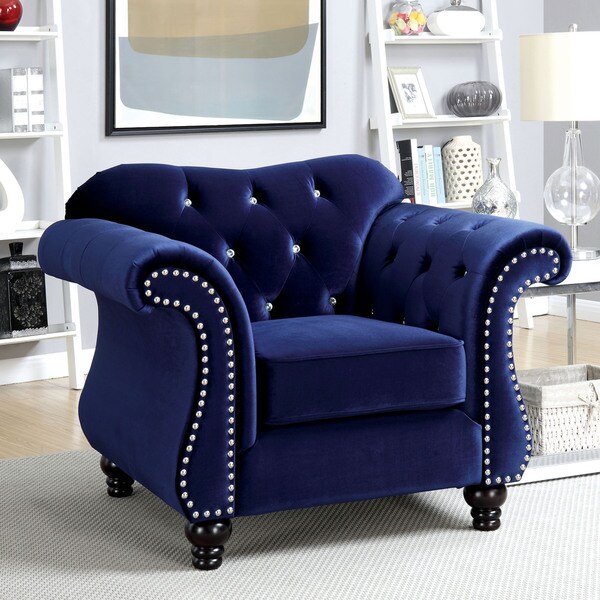 blue tufted armchair