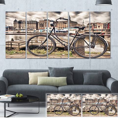 Designart 'Bike Over Bridge in Amsterdam' Cityscape Photo Canvas Print - Brown