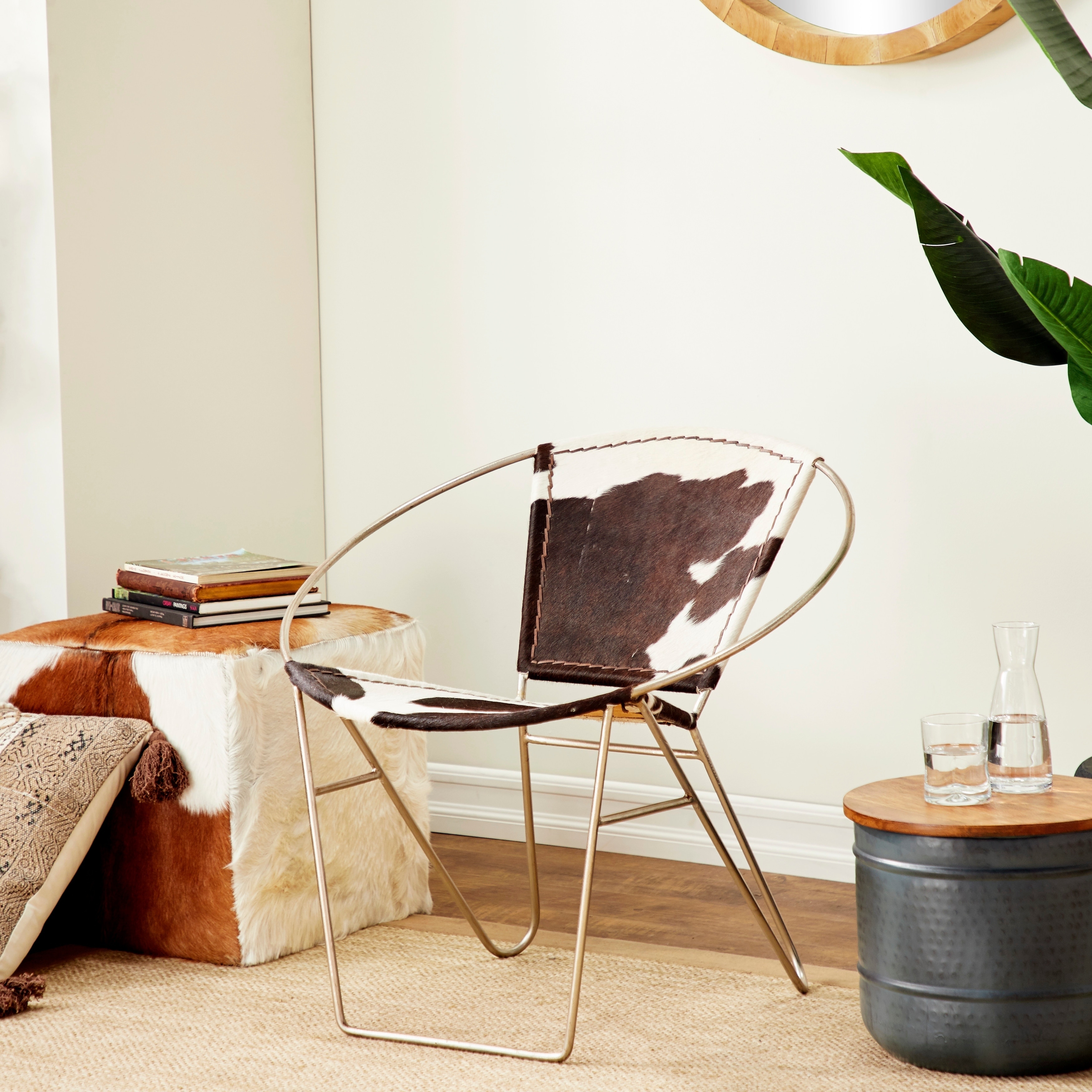Foreign Affairs Home Decor Ulla Modern Cowhide Armchair in Black and White with Silvered Base