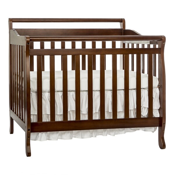 brown mini crib