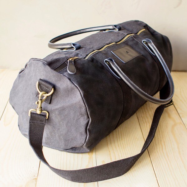 grey leather duffle bag