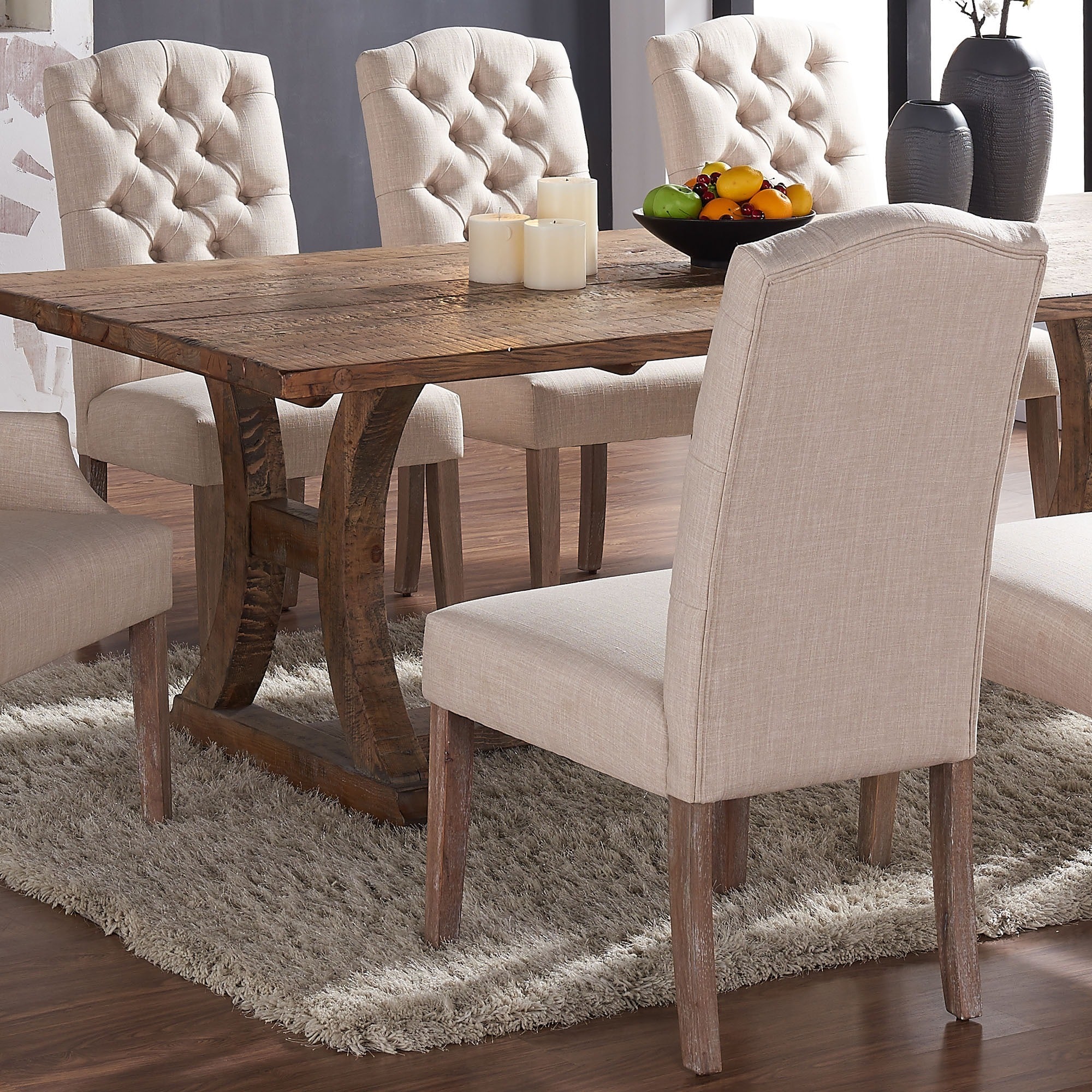 dining room table with tufted chairs