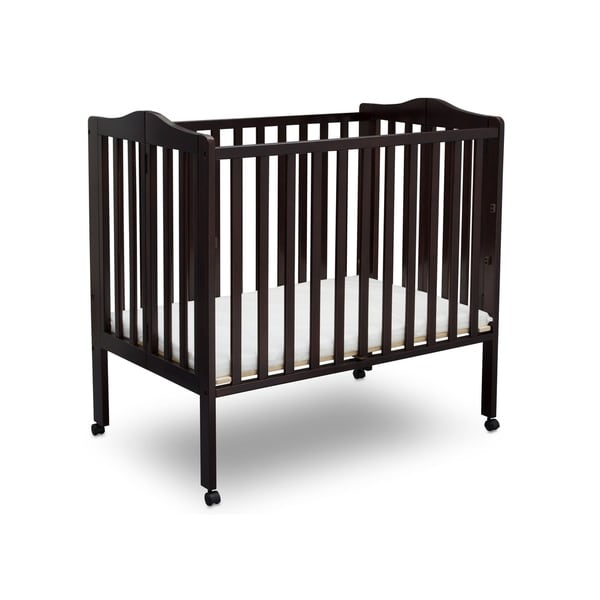 white portable crib