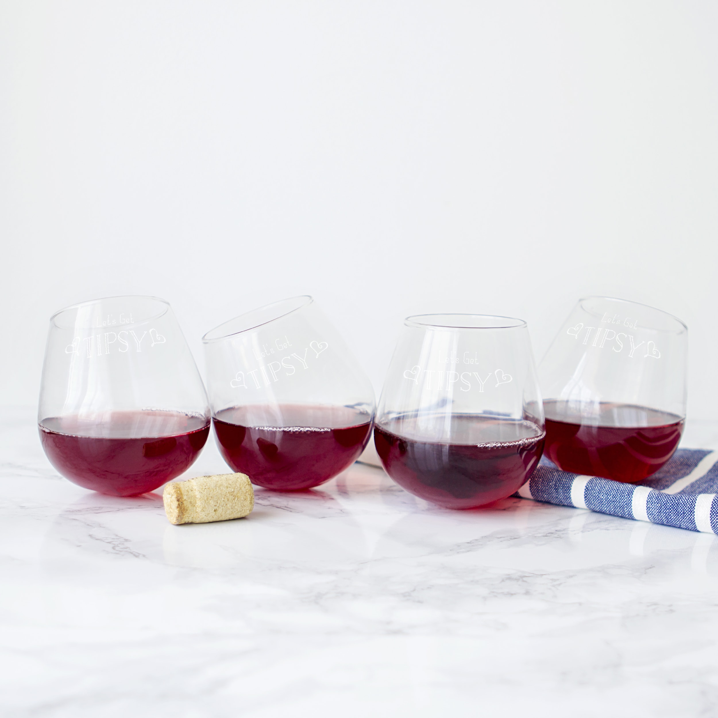 Tipsy Wine Glasses: Set of two delightfully curve wine glasses.