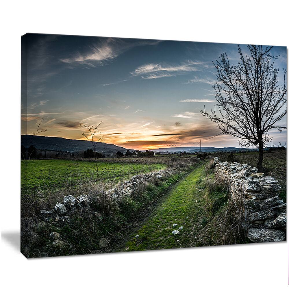 Designart "Rocky Fences in Green Grassland" Extra Large Landscape Art