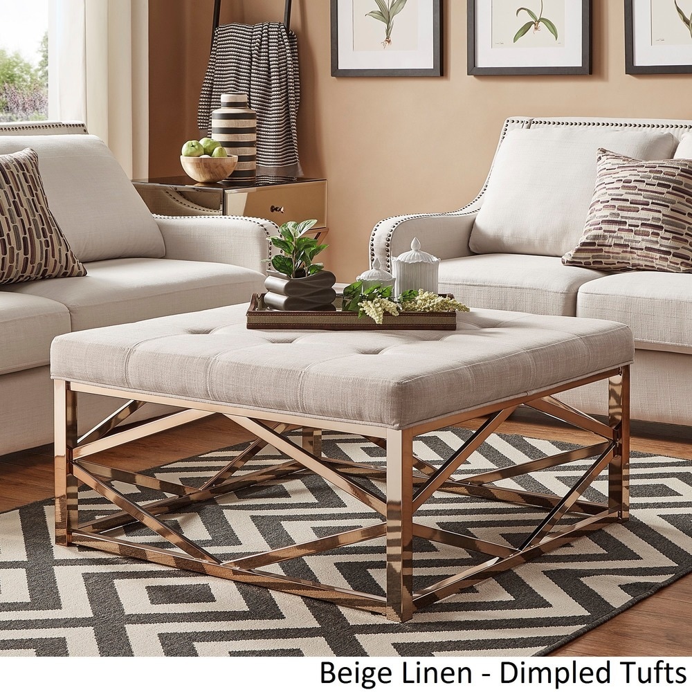 gold coffee table with ottomans