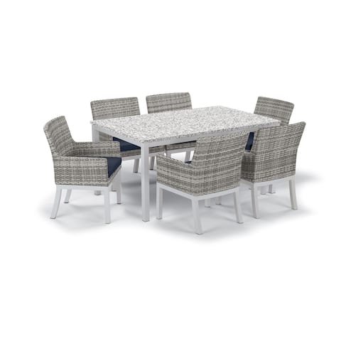 Oxford Garden Travira 7-Piece Dining Set with 63-in x 40-in Lite-Core Ash Table, Argento Wicker with Midnight Blue Cushion