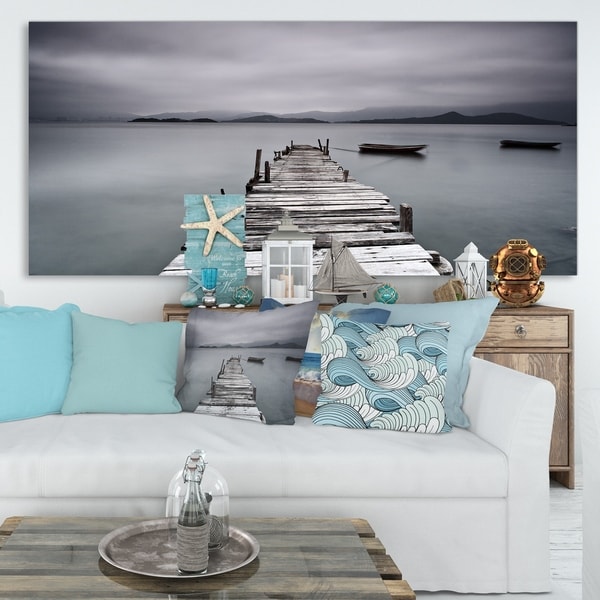 Designart 'Pier and Boats at Seashore' Bridge and Pier Canvas Wall Art