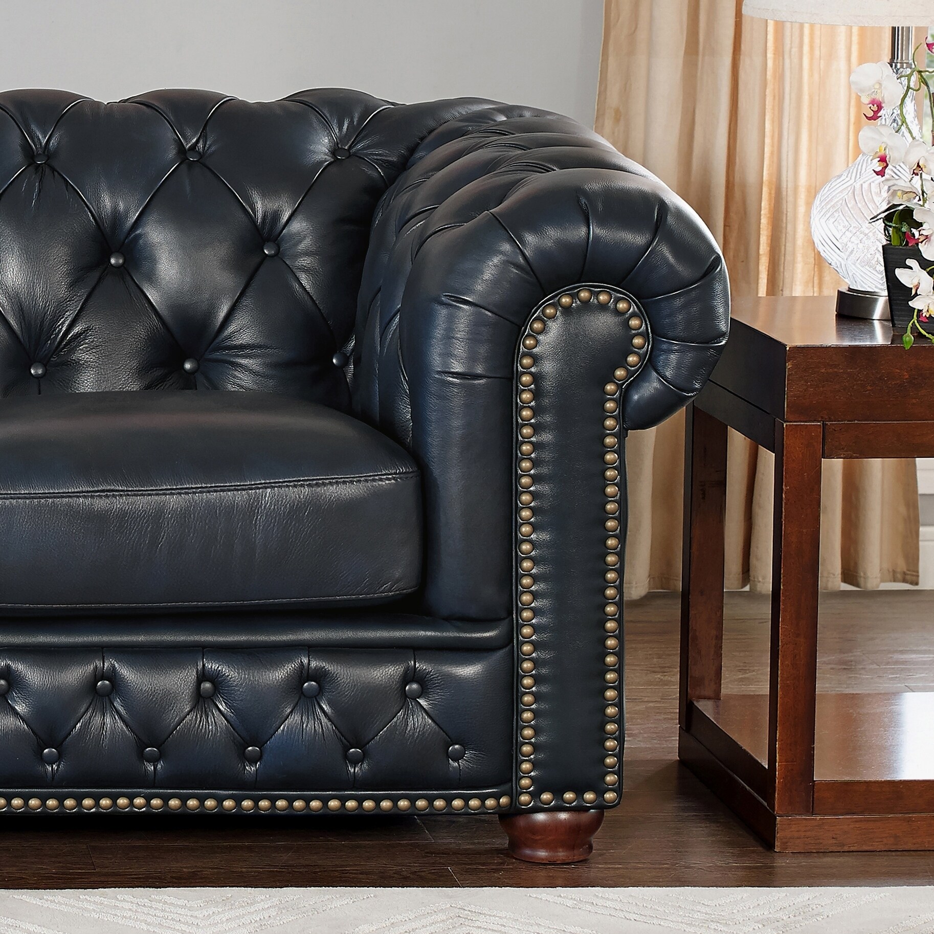 blue tufted leather chair