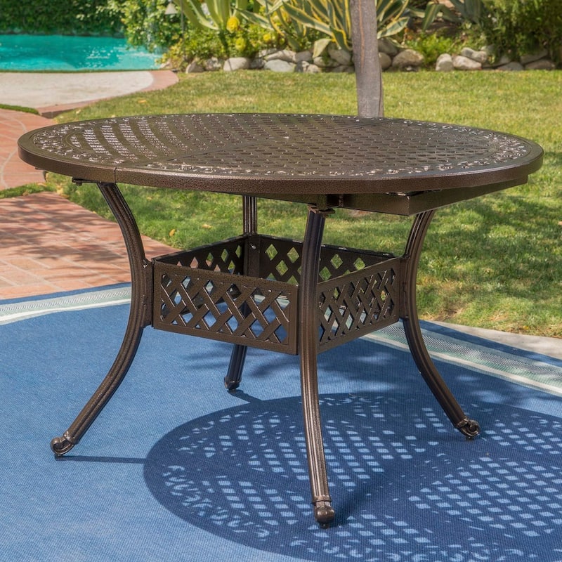 Windley Outdoor Expandable Aluminum Dining Set with Umbrella Hole by Christopher Knight Home