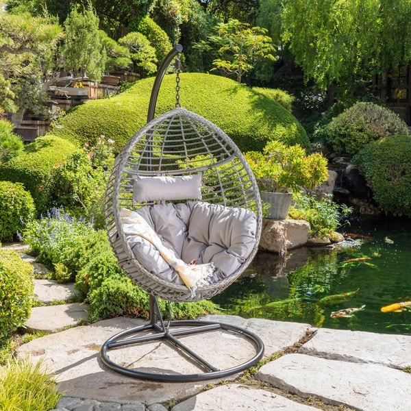 Layla Outdoor Wicker Hanging Basket Chair with Cushion by Christopher Knight Home. Opens flyout.