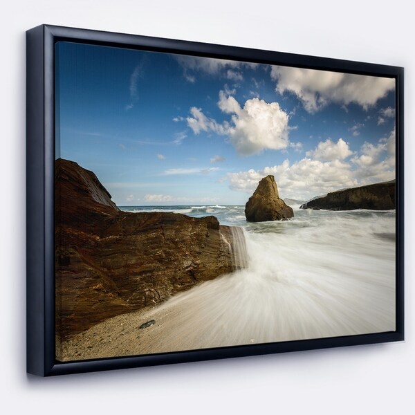 Designart 'Rushing Waters into Rocky Mountains' Seashore Photo Framed Canvas Print