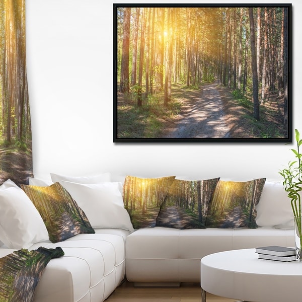 Designart 'Thick Forest with Yellow Sun Rays' Landscape Photography Framed Canvas Print