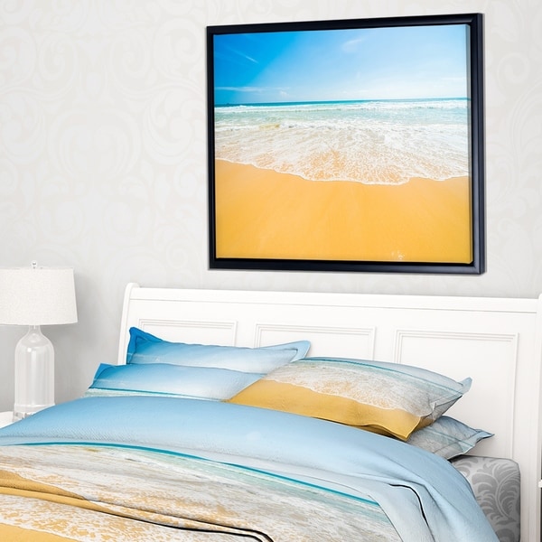 Designart 'Long Waves on Sand under Blue Sky' Seascape Framed Canvas Art Print