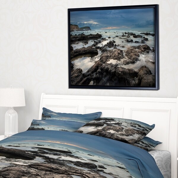 Designart 'Rocky Seashore with Blue Sky Over' Large Seashore Framed Canvas Print