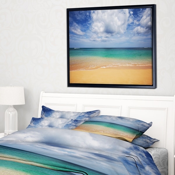 Designart 'Bright Seashore with Heavy Clouds' Modern Beach Framed Canvas Art Print